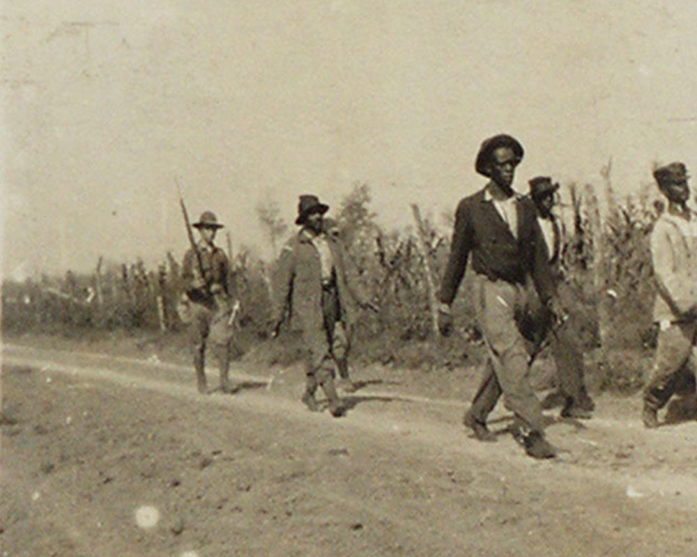Soliders escorted many black residents to makeshift stockades, where soldiers interigated them to get names of PFHUA members. Courtesy of the Arkansas State Archives.