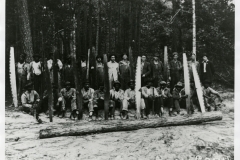 Group of workers posing with saws