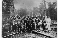 Drilling crew covered with oil in Smackover oil field