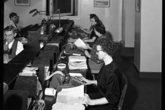 Women using adding machines at state revenue department