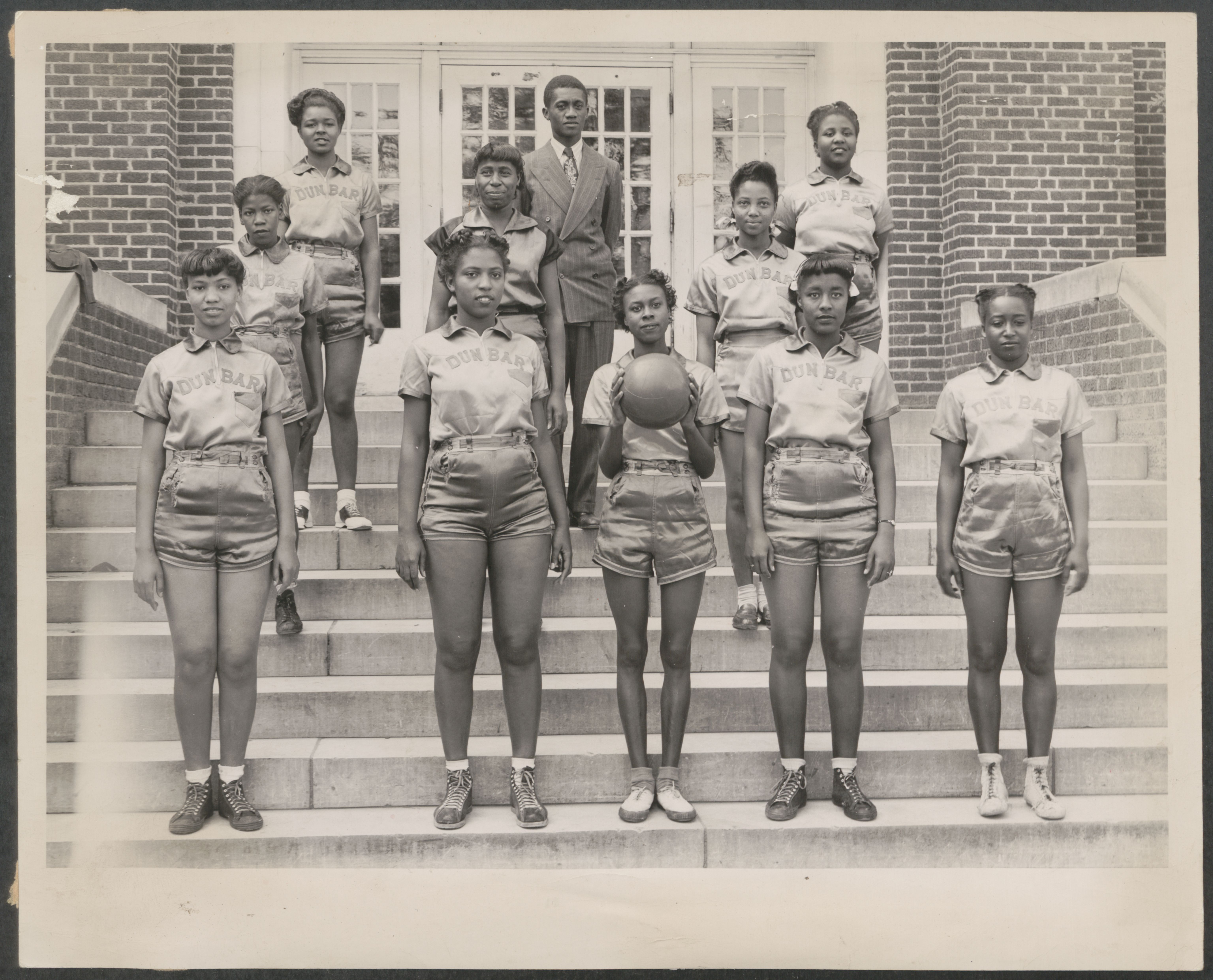 Dunbar High School girls basketball team. National Dunbar Alumni Association historical collection, 1880-2016 (UALR.MS.0021)