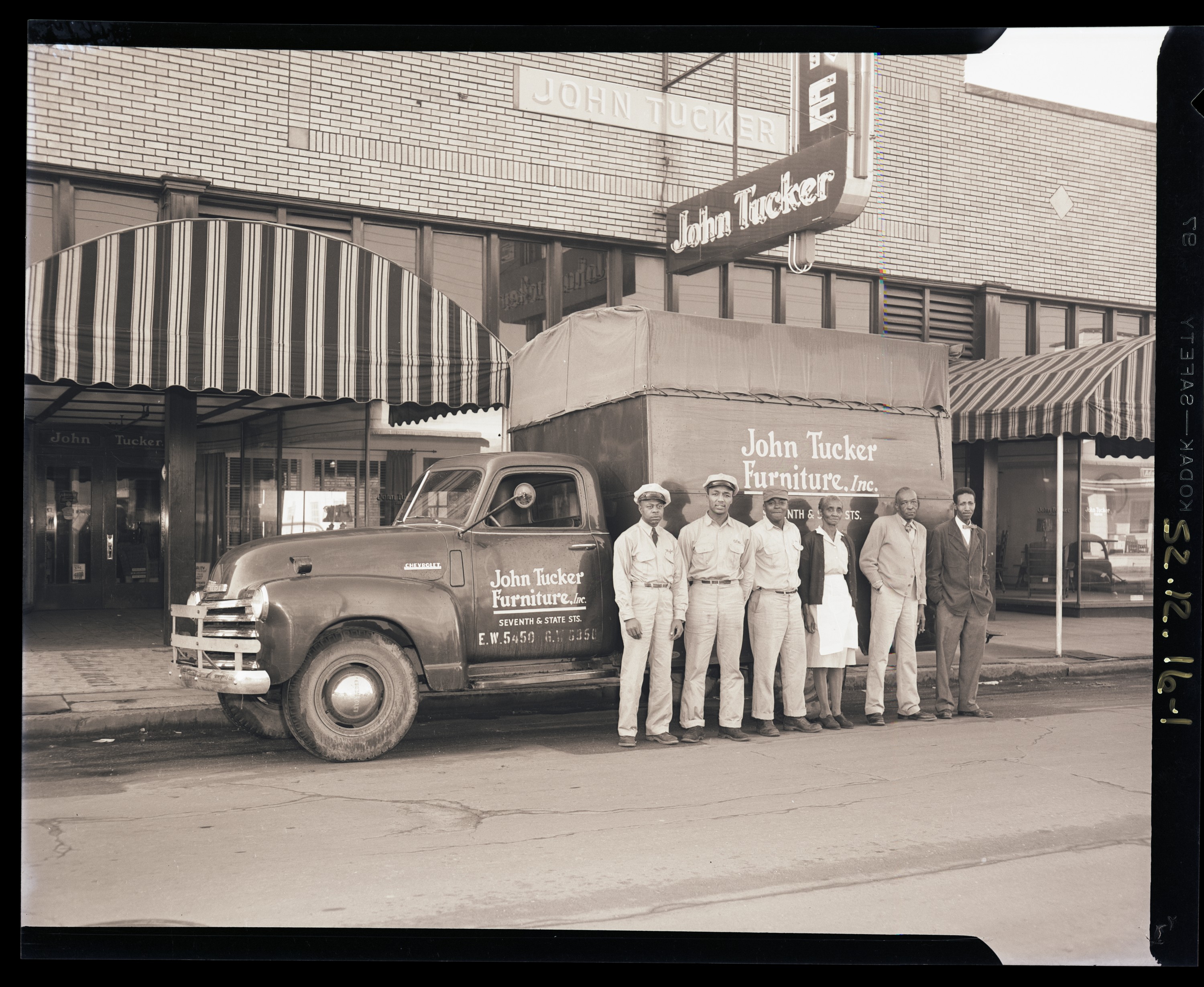 John Tucker Furniture Store: exterior, interior, truck and drivers. Earl Saunders, Jr., photographs, 1870-1977 (UALR.PH.0106)