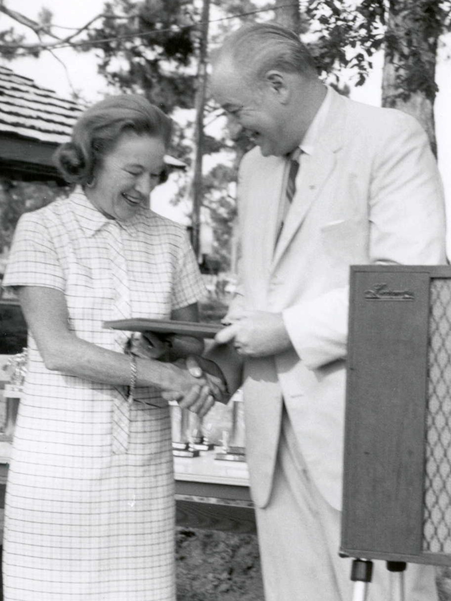 Black and white photograph of Winthrop Rockefeller giving Mary McLeod an award