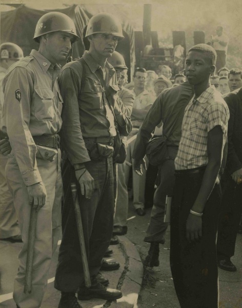 Little Rock Nine member Terrence Roberts faces Arkansas National Guard troops after being denied entry to Central High School, September 4, 1957
