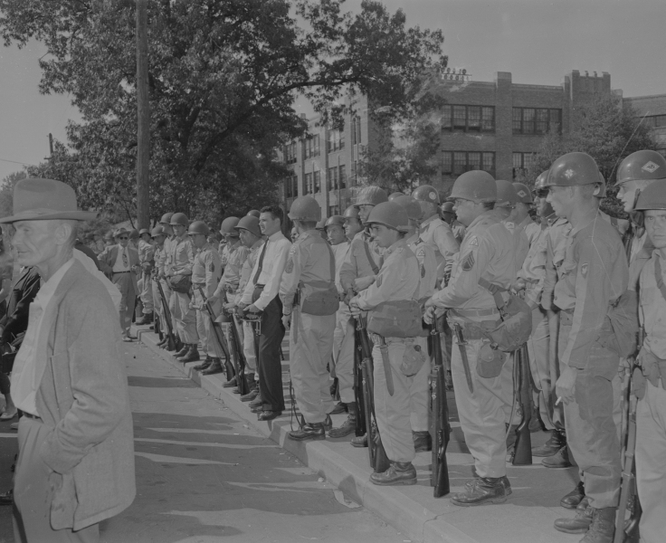 Soldiers lined up outside Central High School during the desegregation crisis, 1957