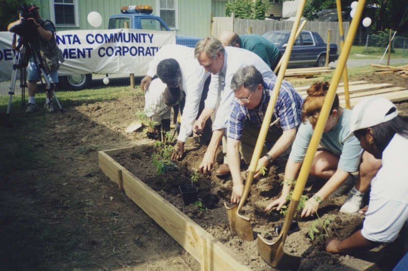 Snyder and Mayor Pat Hays participating in an Argenta Community Garden event in North Little Rock, circa 2001