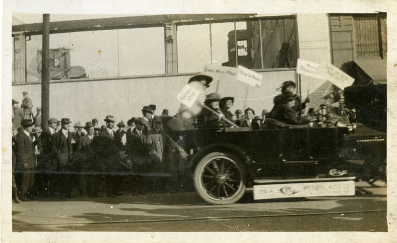 Protestors for women's suffrage drive by the 200 block of Main Street in Little Rock.