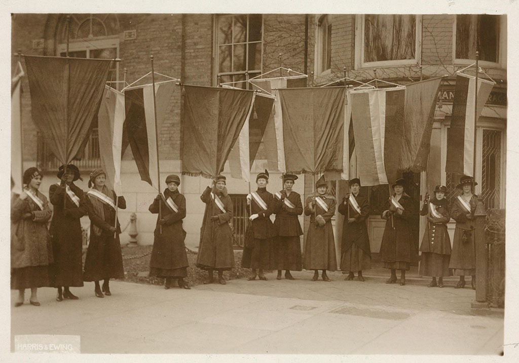 The first suffrage picket line leaving the National Woman's Party headquarters to march to the White House gates on January 10, 1917, featuring Pauline Floyd of El Dorado, Arkansas.