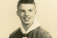 Jim Guy Tucker in boy scout uniform