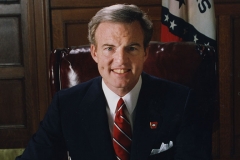 Governor Jim Guy Tucker poses at desk Governor Jim Guy Tucker poses at desk