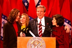 Jim Guy Tucker, with family, delivering speech on Inauguration Day