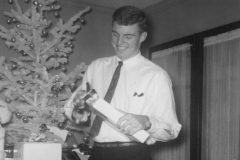 Jim Guy Tucker opening present on Christmas