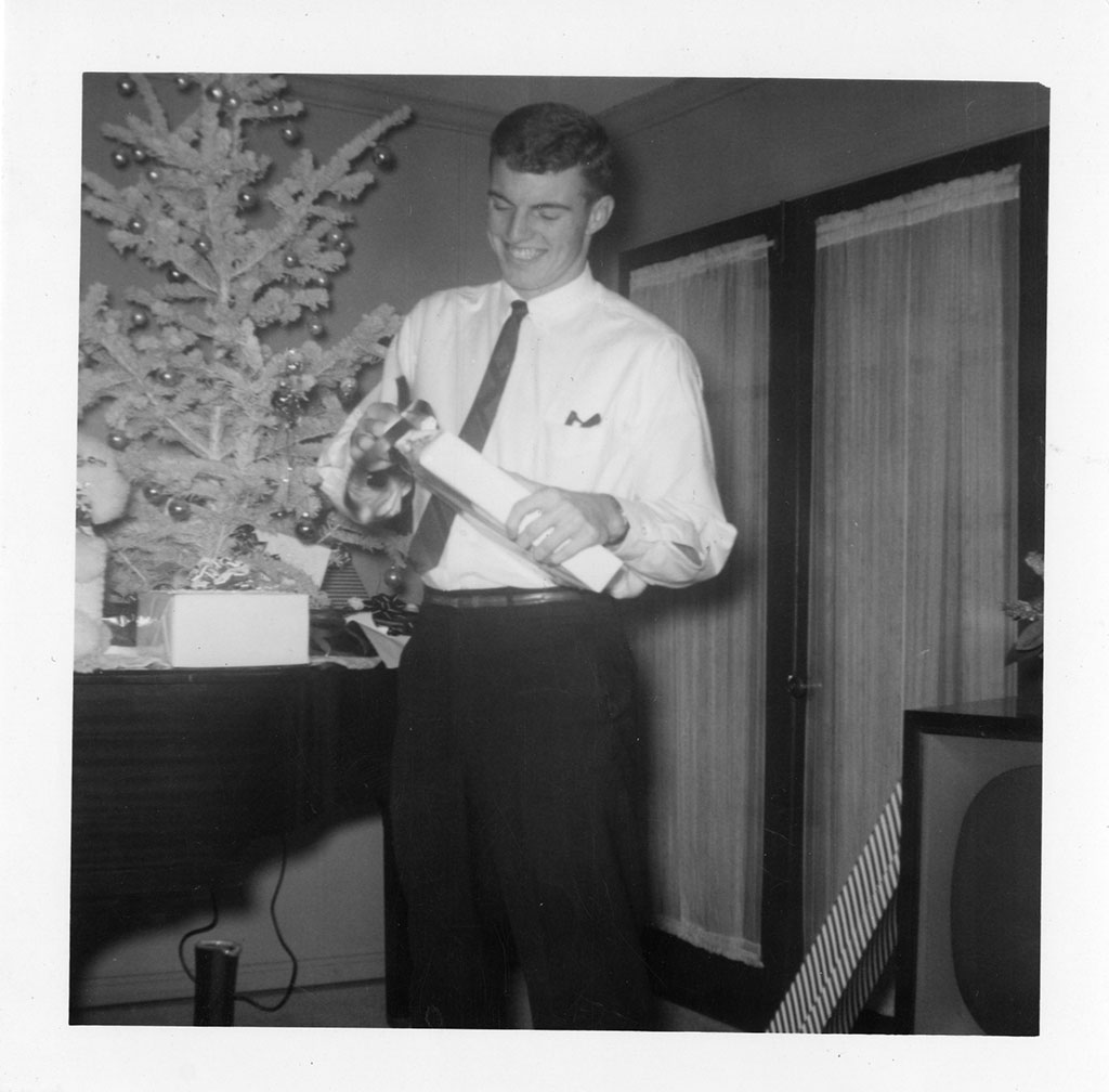 Jim Guy Tucker opening present on Christmas Jim Guy Tucker opening present on Christmas
