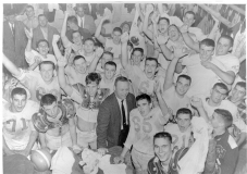 Jim Guy Tucker celebrating with Hall High School football team, Little Rock