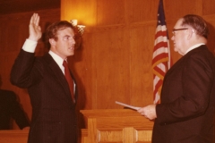 Judge Kirby swearing in Jim Guy Tucker as prosecuting attorney
