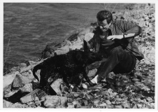 Jim Guy Tucker with 'champion duck dog' near Arkansas River, 1972