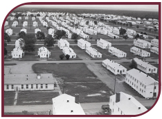 Black and white aerial photograph of Fort Chaffee with rows of white buildings