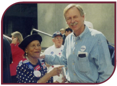 Color photograph of Snyder with an unidentified woman at a campaign event