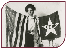 Black and white photograph of suffragette Bernie Babcock holding a suffrage banner and American flag