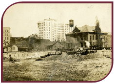 Sepia photograph of the construction site of the Arcade