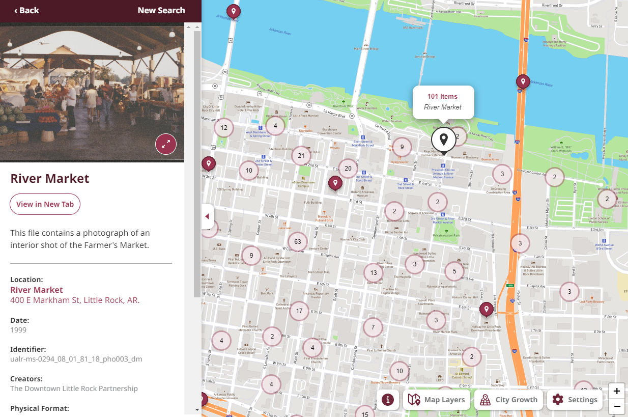 Screenshot of a map of downtown Little Rock covered in pins. A side panel displays a color photograph of the River Market and descriptions about the photograph.
