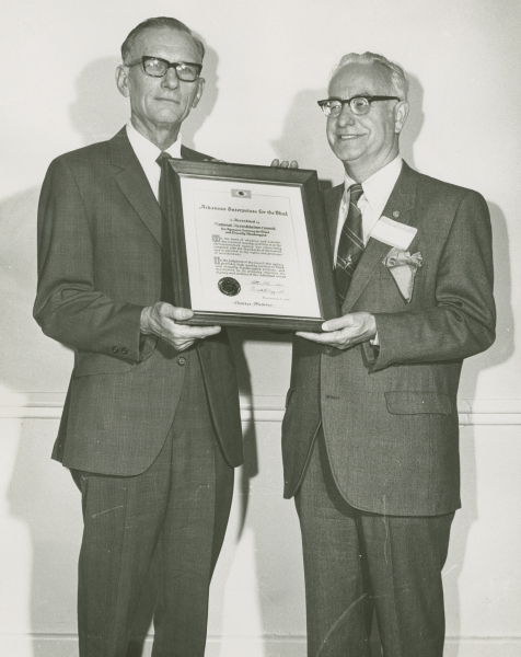 James Max Woolly and Roy Kumpe holding the NAC certification, 1970