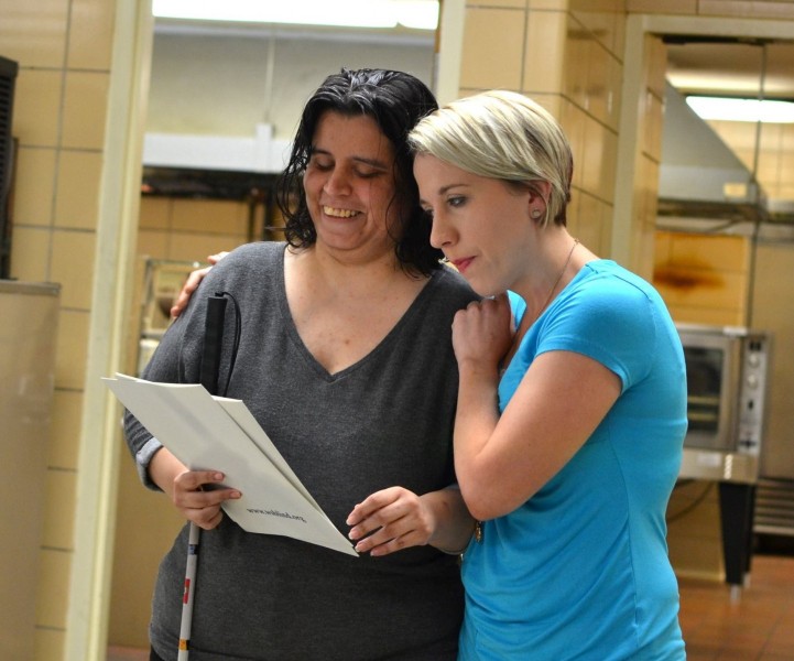 WSB staff member hugging the first graduate of the Small Business Management program, 14 April 2017