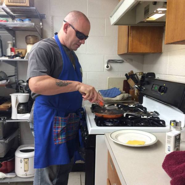 Client learning how to cook hamburgers, 16 September 2016