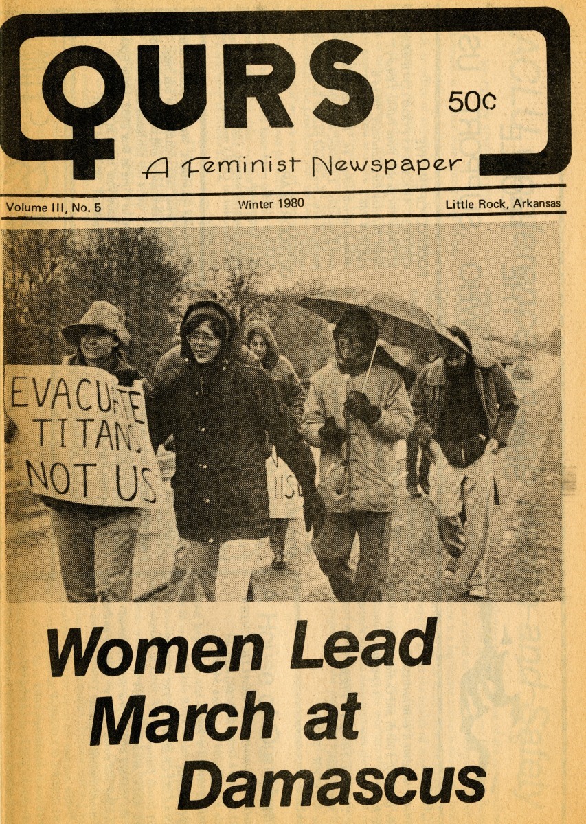 Clipping from OURS: A Feminist Newspaper. The headline reads, "Women Lead March at Damascus."  In the image, a group of women march in the cold and rain. One woman holds a sign that says "Evacuate Titans Not Us."