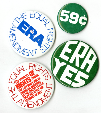 Photograph of four ERA buttons. Button 1: The Equal Rights Amendment ERA written in blue on a white background. Button 2: The Equal Rights Amendment. "Equality of rights under the law shall not be denied or abridged by the United States or by any state on account of sex"  written in red on a white background. Button 3: 59 cents written in white on a green background. Button 4: ERA Yes written in white on a green background.