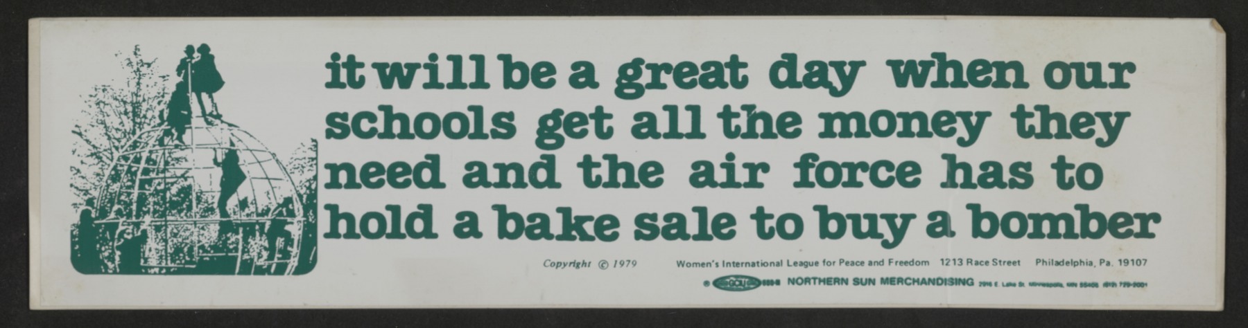 A bumper sticker with a picture of kids climbing on a play structure reads, "It will be a great day when our schools get all the money they need and the air force has to hold a bake sale to buy a bomber."
